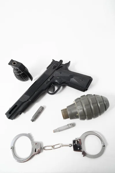 Balas de granada Arma e algemas — Fotografia de Stock
