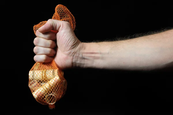 Dinero atrapado y una mano — Foto de Stock