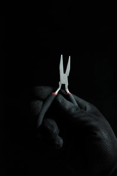 Pliers and a Hand — Stock Photo, Image