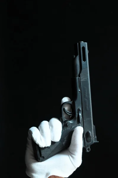 Gun and a Hand — Stock Photo, Image