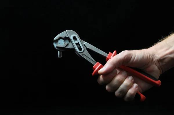 Pliers and a Hand — Stock Photo, Image