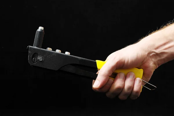 Rivets Pliers and a Hand — Stock Photo, Image