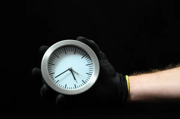 Reloj y una mano — Foto de Stock