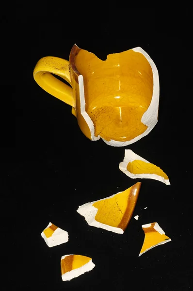 Gebroken oranje coffekop — Stockfoto