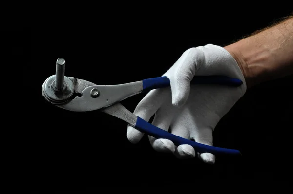 Pliers and a Hand — Stock Photo, Image