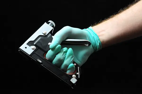 Stapler Pliers and a Hand — Stock Photo, Image