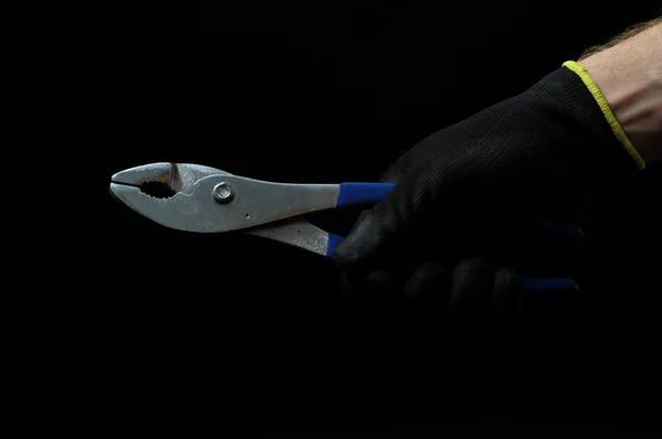 Pliers and a Hand — Stock Photo, Image