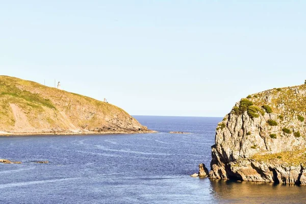 岩だらけの海岸背景としての写真デジタル画像 — ストック写真