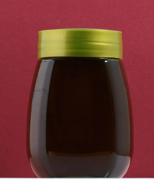 One Full Honey Jar Colored Background — Stock Photo, Image