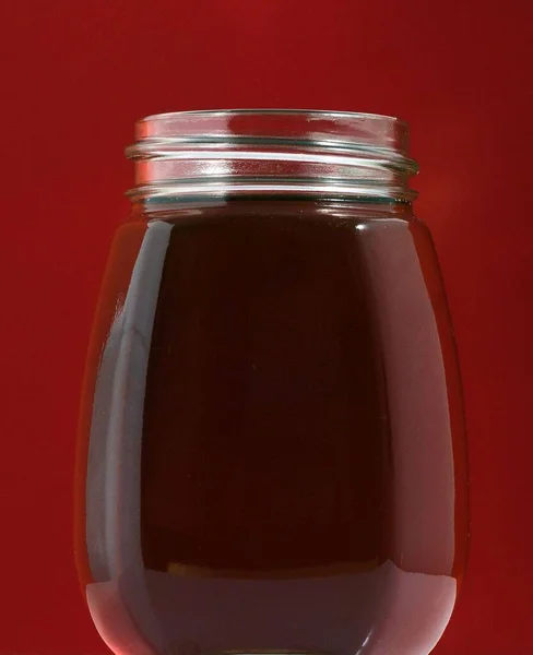 One Full Honey Jar Colored Background — Stock Photo, Image