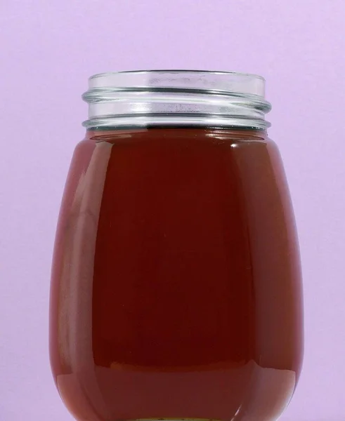 One Full Honey Jar Egy Színes Háttér — Stock Fotó