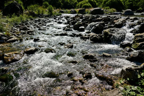 mountain river, stones on a rocky coast