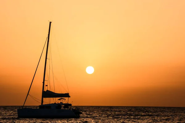 Photo Picture of a Sail Boat Silhouette  at Sunset