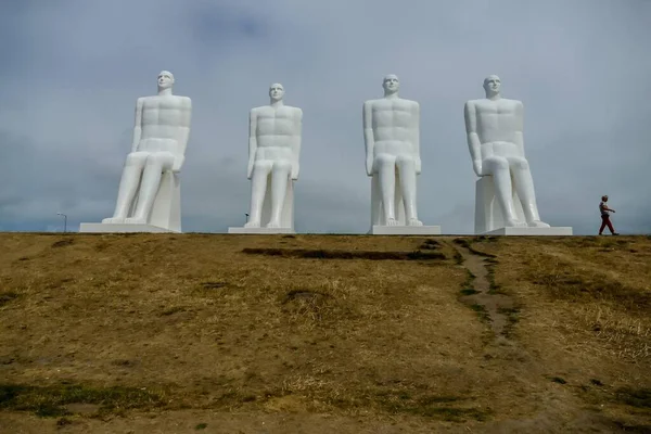 Men at Sea or Man meets the sea is a 9-metre (30 feet) tall white monument of four seated males, located west of Esbjerg next to Sadding Beach on the southwest coast of Denmark.