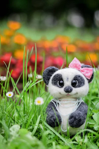 Stock image a small panda made of wool with your own hands