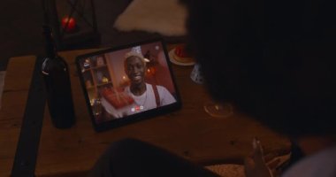 African couple celebrating birthday during video chat