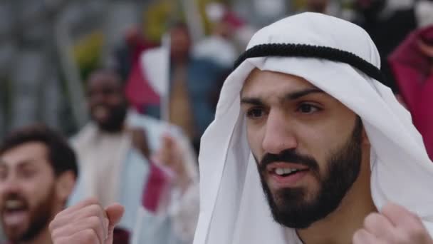 Muslim man celebrating victory during soccer match — Stock Video