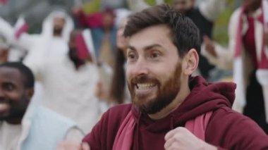 Man celebrating goal of favorite team during football game