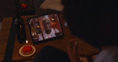 Woman using tablet for celebrating her man birthday online