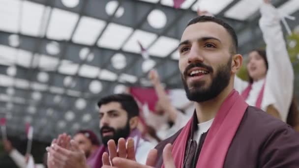 Muslim man sincerely supporting team during football game — 비디오