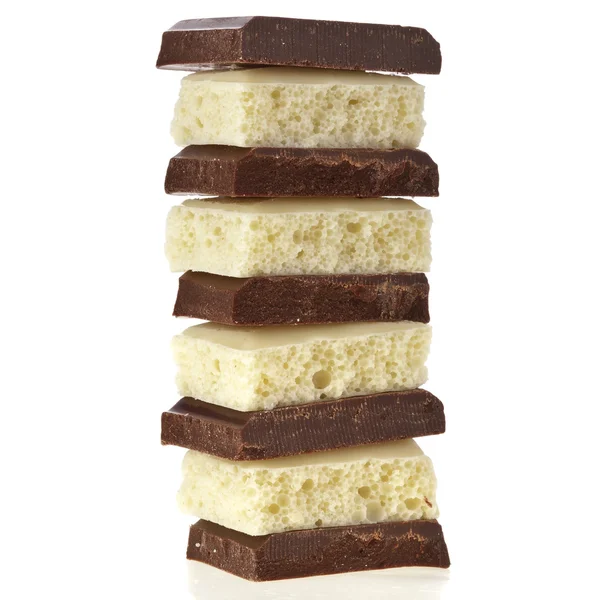 tower stack of chocolate pieces on white background