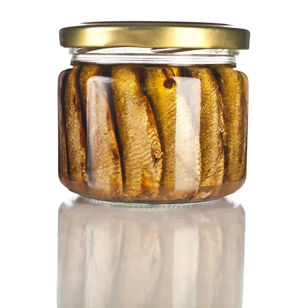 Sardines fishes with oil conserved in glass jar close up isolated on