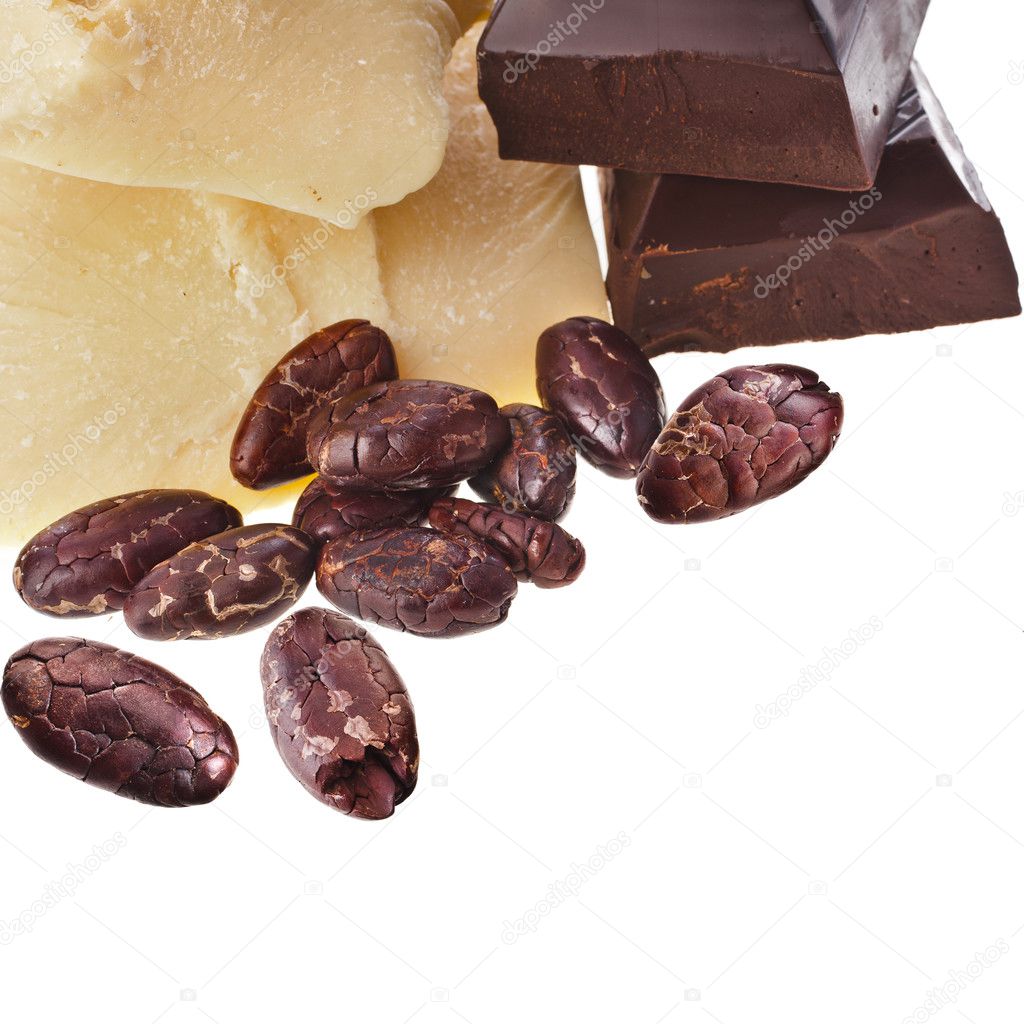 Cocoa butter, chocolate pieces and beans heap close up isolated on white background — Stock