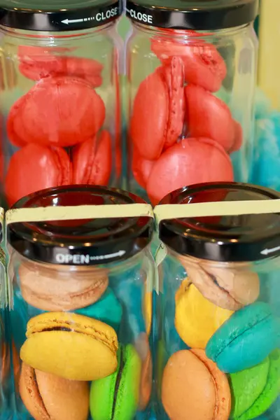 French macaroons in glass bottles. — Stock Photo, Image