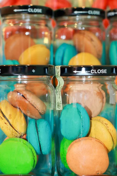 French macaroons in glass bottles. — Stock Photo, Image