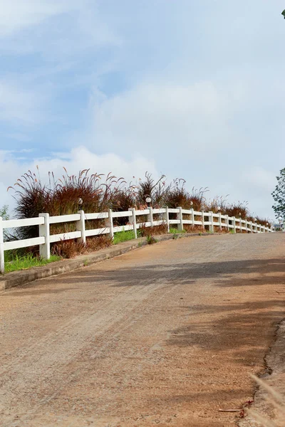 White fence with road — Stock Photo, Image