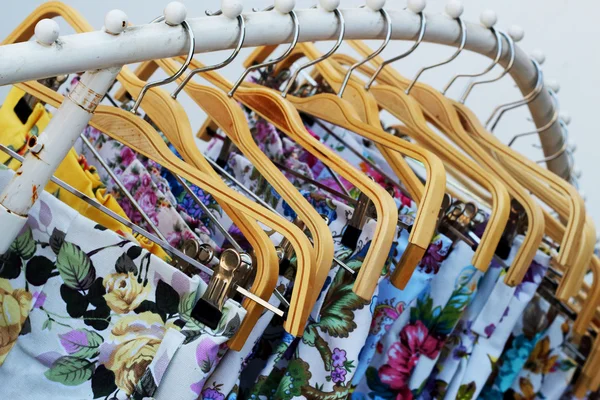 Shop pants hanging on a rack market. — Stock Photo, Image