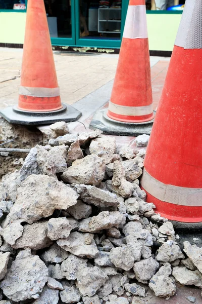 Traffic cones on the damaged roads — Stock Photo, Image