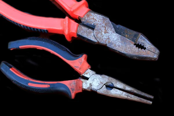 Pliers red handle tool on the wood — Stock Photo, Image