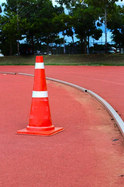 Traffic cones on running track — Stock Photo, Image