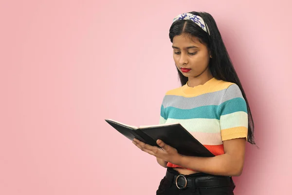 Portrait Young Cute Indian Asian Girl Standing Posing Isolated Reading Zdjęcie Stockowe
