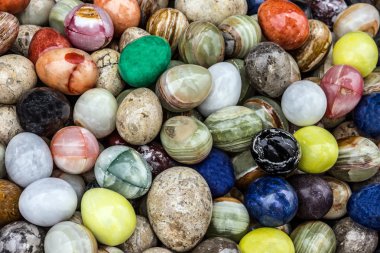 Colored stone onyx eggs in fabric, Turkey clipart