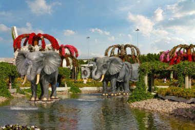 Dubai, UAE - April 26, 2022: Miracle garden decoration with elephants in Dubai.
