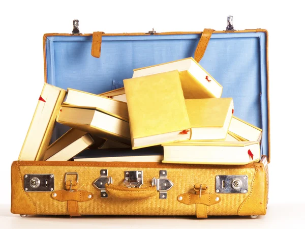 A travel suitcase full of books on a white background — Stock Photo, Image