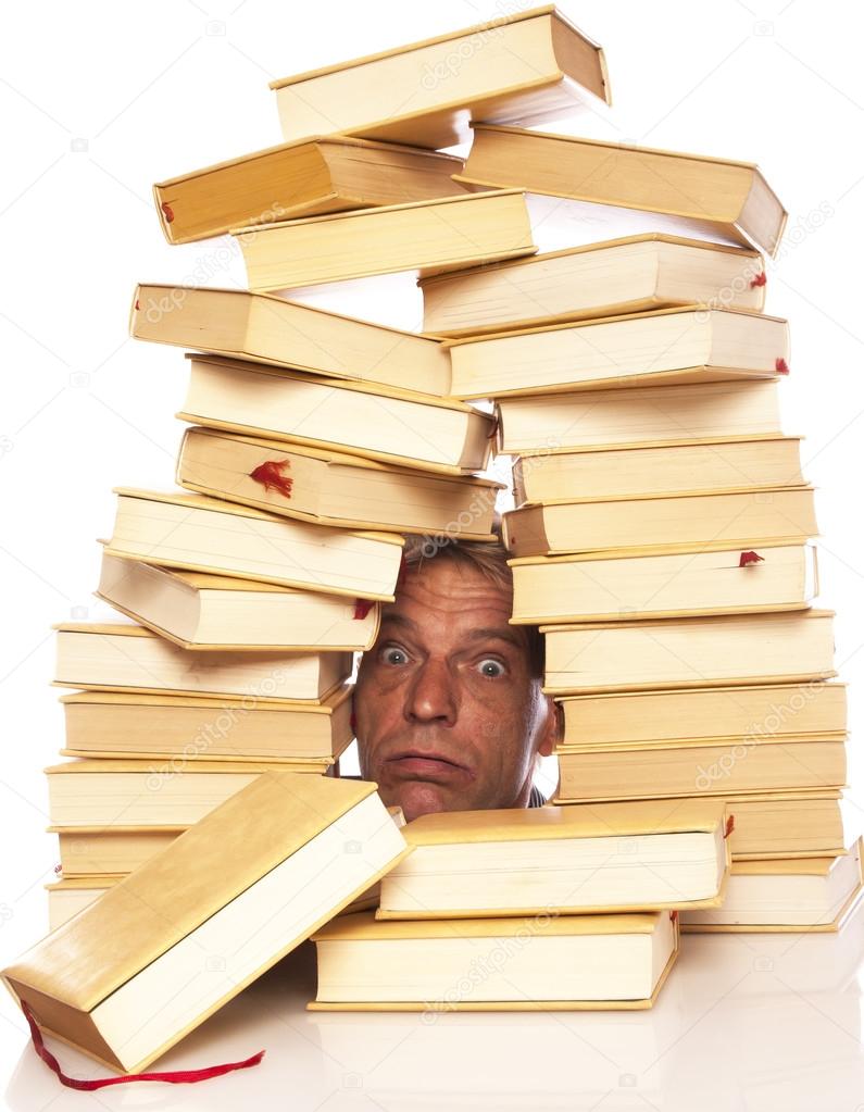 Man with head between books on a white background