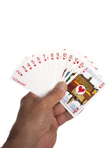 Playing cards in hand as a background — Stock Photo, Image
