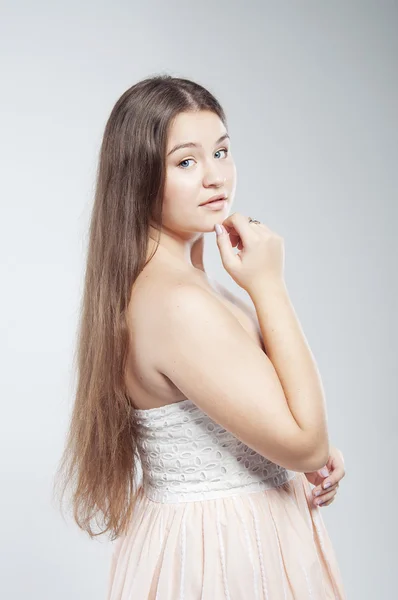 Beautiful plump young woman with long hair — Stock Photo, Image