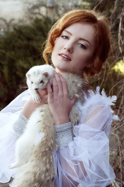 Redheaded princess with a white ferret — Stock Photo, Image