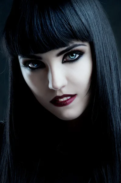 Gorgeous brunette with dark makeup and white skin — Stock Photo, Image
