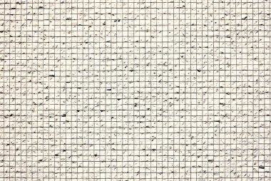 Beyaz küp taşıyla dekore edilmiş bir duvar fotoğrafı.