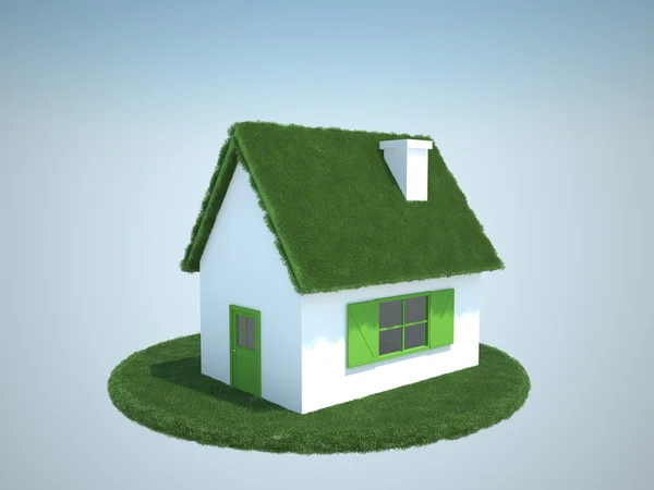 Дом с крышей из зелёных гр — стоковое фото