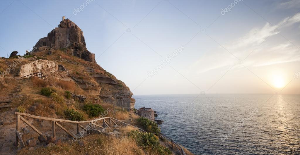 panorama of castle on Capraia island with rising sun, Elba, Tusc