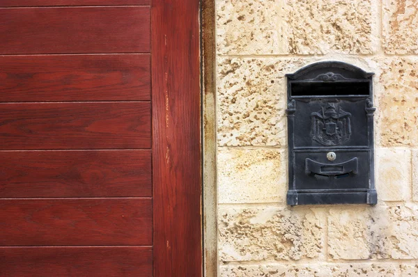 Old metal mail box with a wooden door — Stock Photo, Image