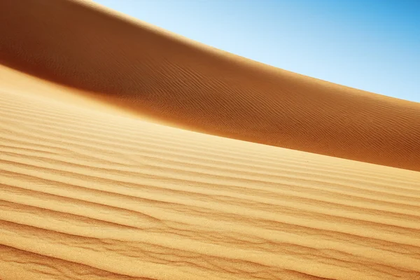 Dunas de areia rolando do deserto árabe — Fotografia de Stock