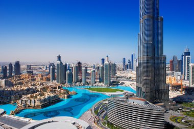 Downtown Dubai is a popular place for shopping and sightseeing clipart