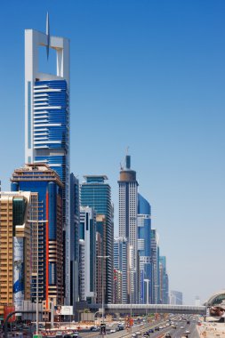 Sheikh Zayed Road is graced with skyscrapers for miles clipart